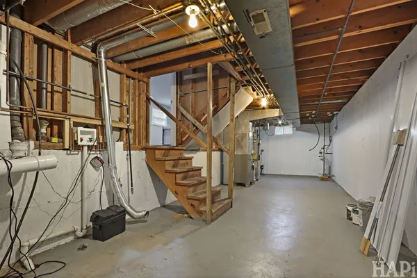a view of an empty room with stairs