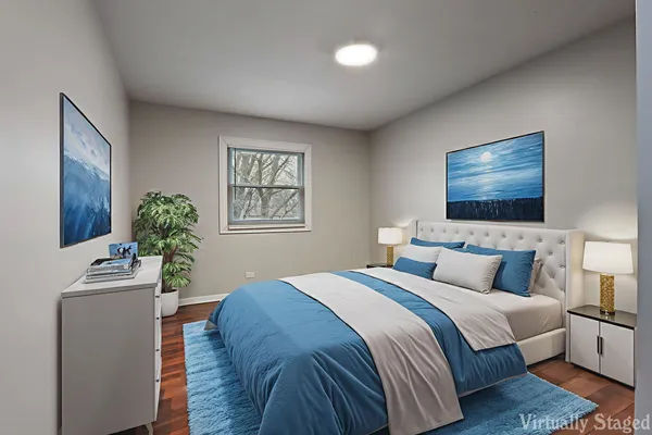 a bedroom with a bed and a potted plant