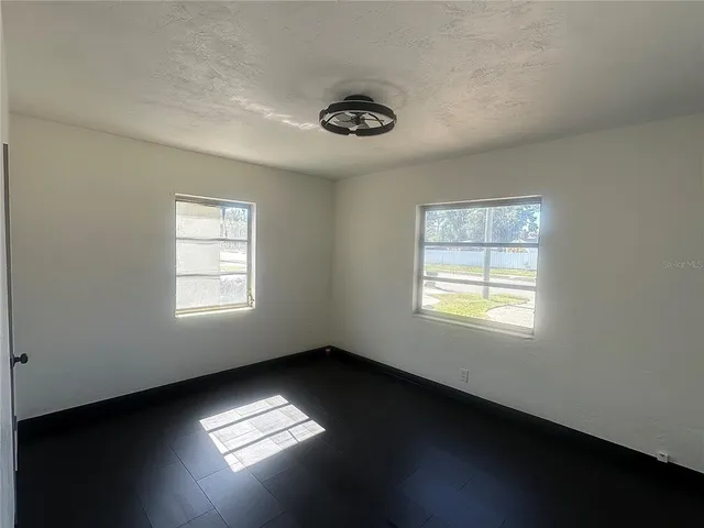 a view of an empty room with a window