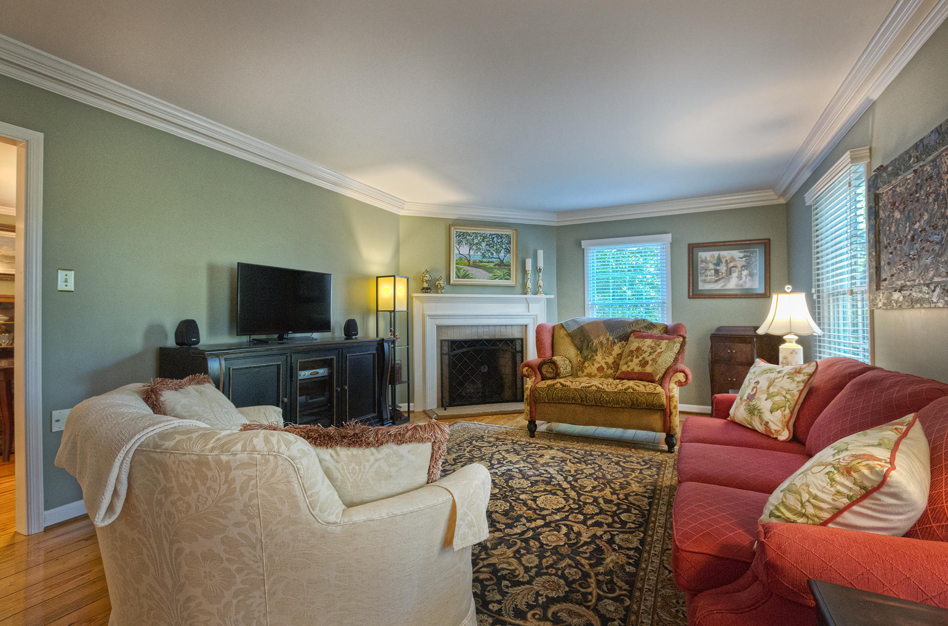5233 Falcon Ridge Road Roanoke, VA 24018 - Photo 11 of 50 a living room with furniture a flat screen tv and a fireplace