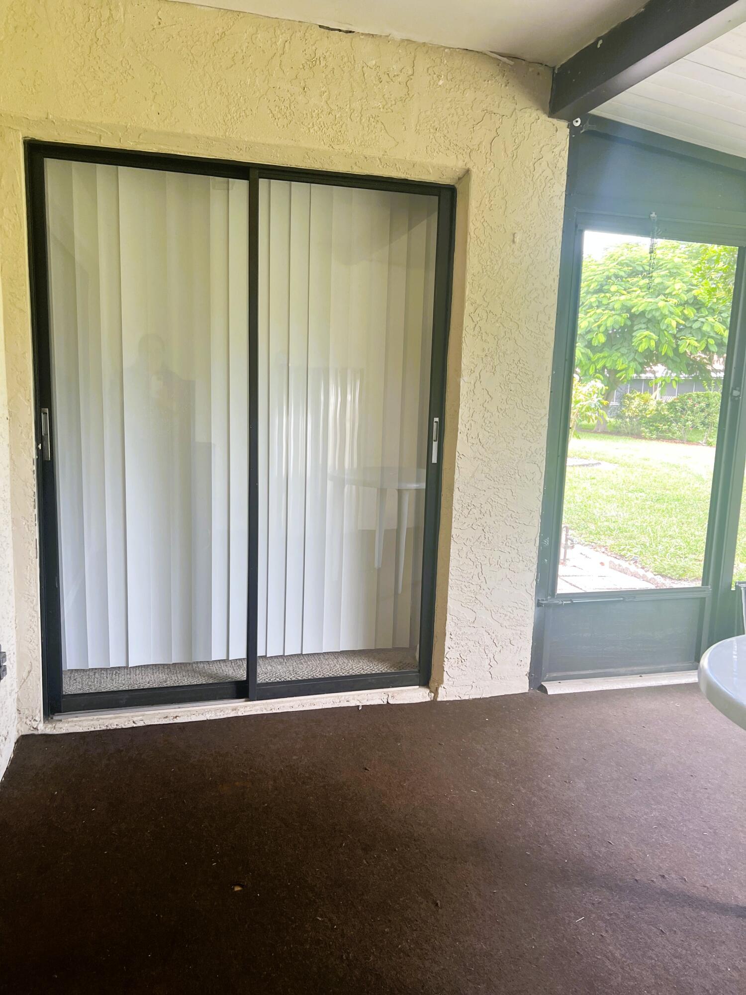 6032 Indrio Road, Unit 8 Fort Pierce, FL 34951 - Photo 15 of 26 Screened patio