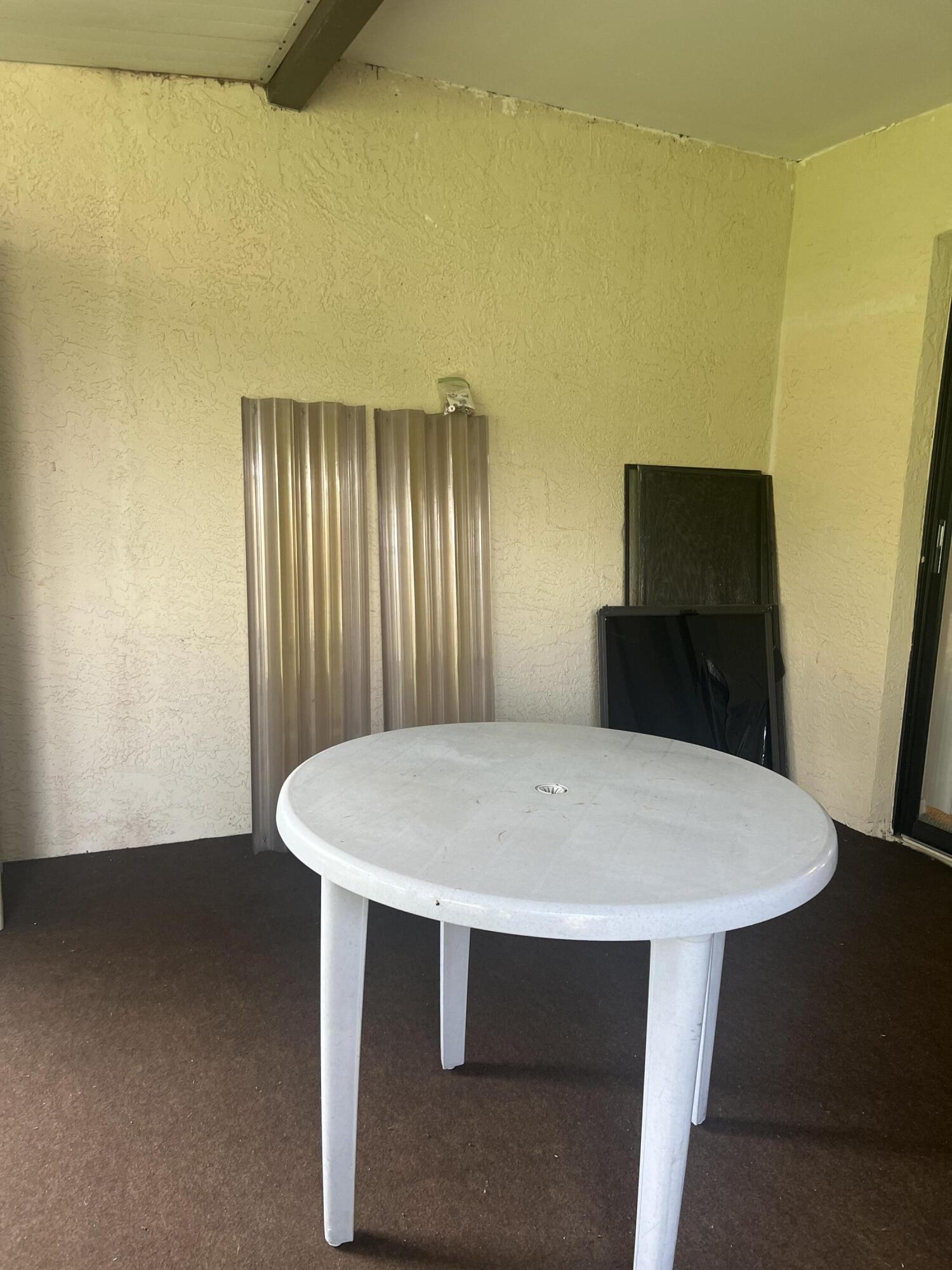 6032 Indrio Road, Unit 8 Fort Pierce, FL 34951 - Photo 16 of 26 Screened patio