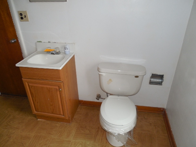 5925 Island Road Harvard, IL 60033 - Photo 18 of 22 a bathroom with a toilet and a sink