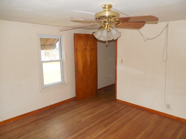 5925 Island Road Harvard, IL 60033 - Photo 20 of 22 a view of a room with a window and wooden floor