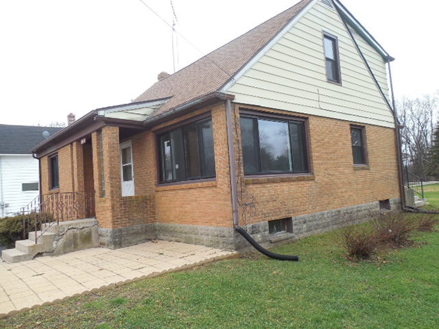 5925 Island Road Harvard, IL 60033 - Photo 2 of 22 a front view of a house with a yard
