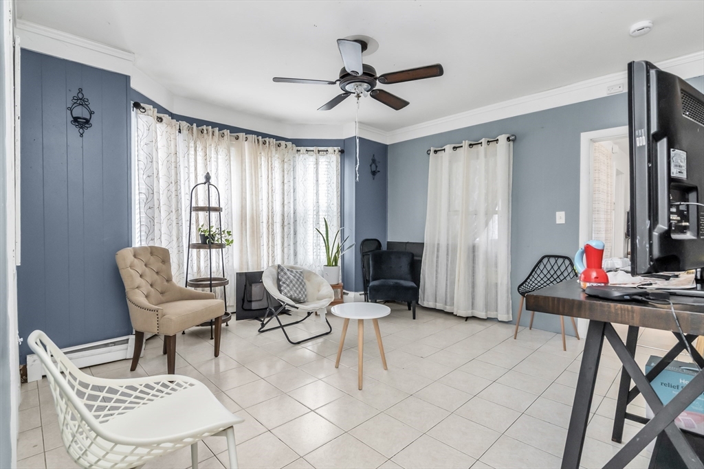 70 Butler Street Lawrence, MA 01841 - Photo 12 of 19 a living room with furniture and a window