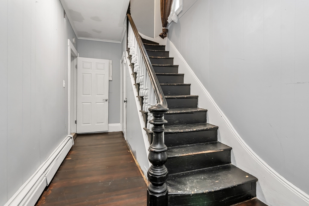 70 Butler Street Lawrence, MA 01841 - Photo 4 of 19 a view of entryway and hall with wooden floor