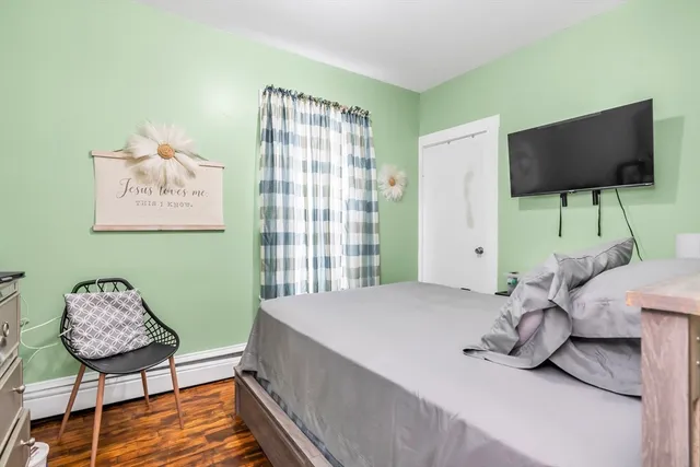 a bedroom with a bed and chair