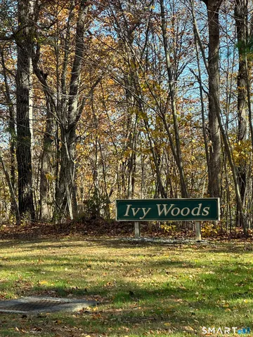 a view of a swimming pool with an outdoor seating and a yard