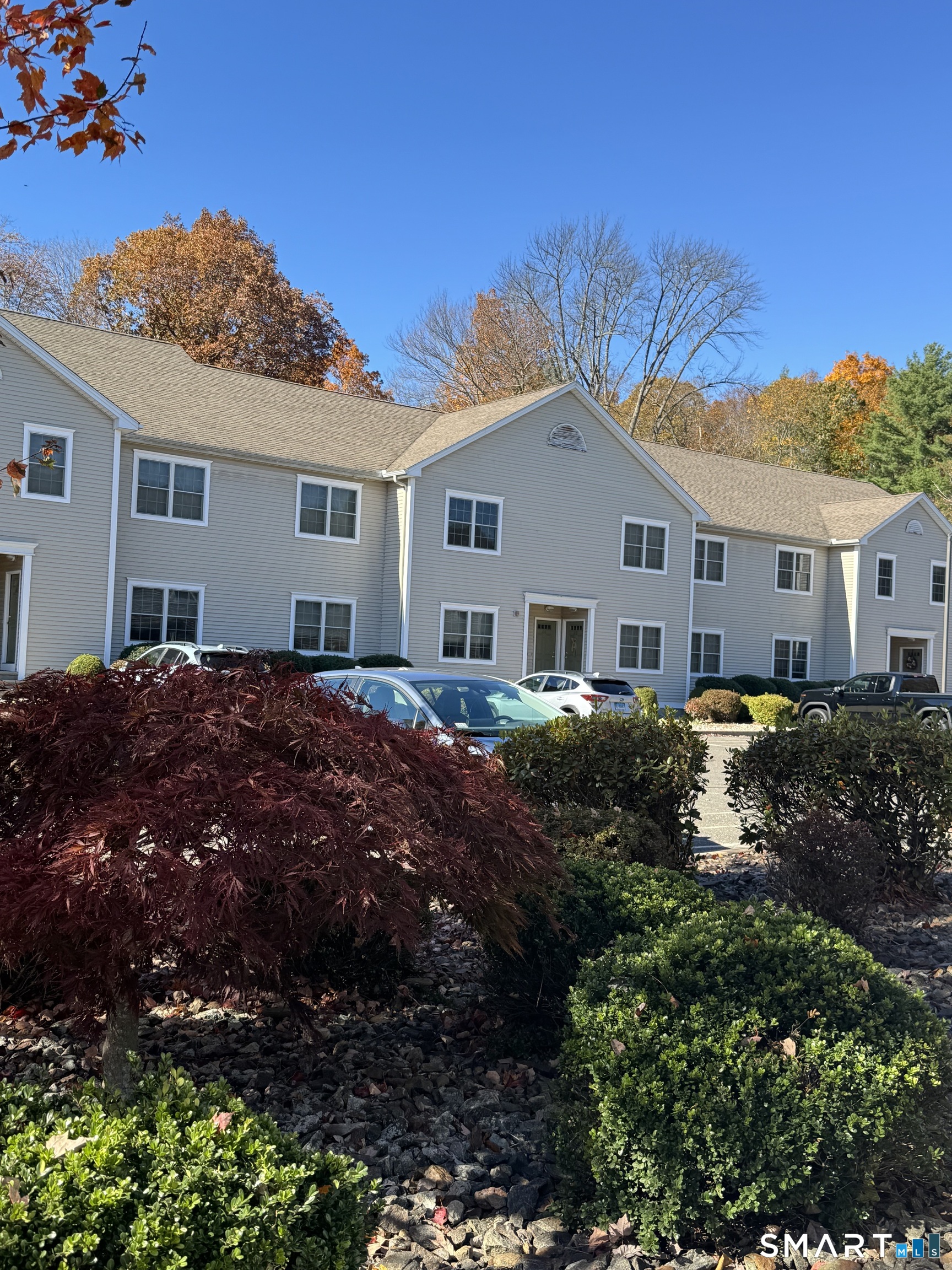 87 Buff Cap Road Tolland, CT 06084 - Photo 2 of 6 a view of house with a big yard and potted plants