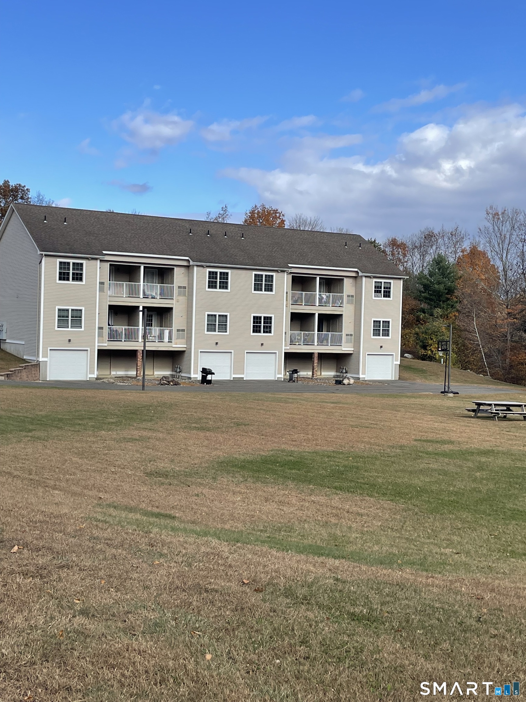87 Buff Cap Road Tolland, CT 06084 - Photo 5 of 6 a front view of a house with a yard