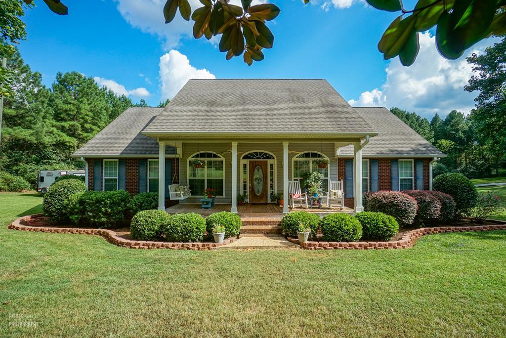 121 Gordon Road Gray, GA 31032 - Photo 1 of 32 a front view of a house with porch and garden