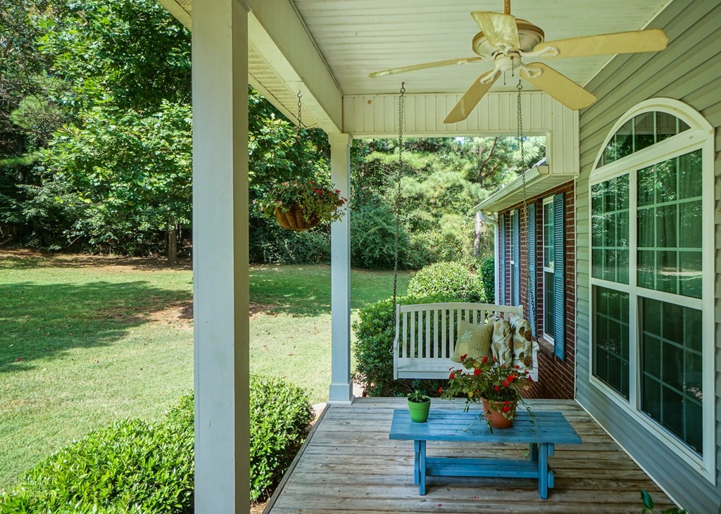 121 Gordon Road Gray, GA 31032 - Photo 3 of 32 a view of a porch with a table chairs and a yard