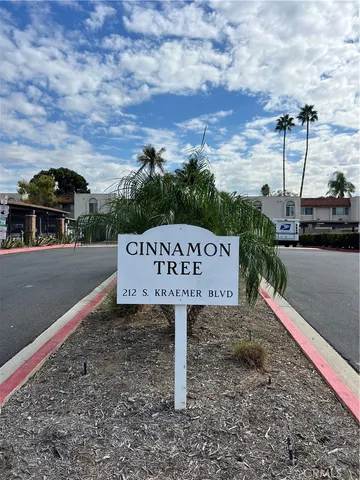 a view of a street with a park