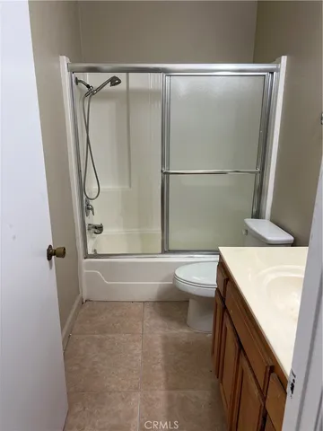 a bathroom with a sink a toilet and a shower