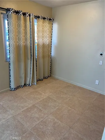 a bathroom with a window shower and vanity