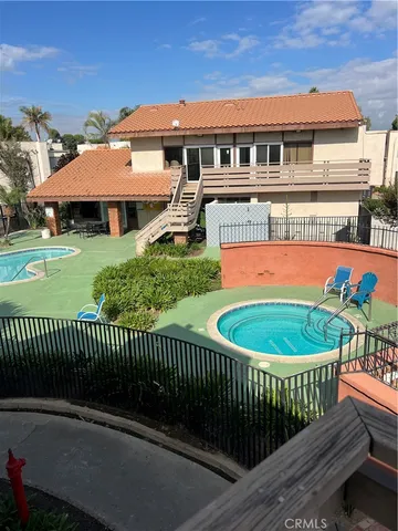 a balcony with table and chairs