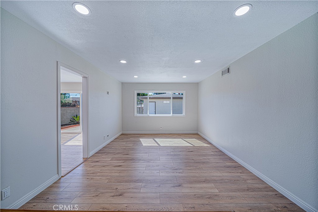 1480 East Colver Place Covina, CA 91724 - Photo 12 of 31 a view of an empty room with window and wooden floor