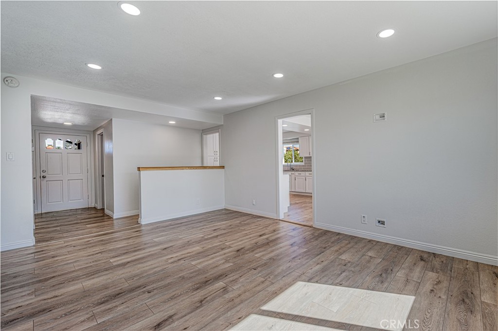 1480 East Colver Place Covina, CA 91724 - Photo 14 of 31 an empty room with wooden floor and windows
