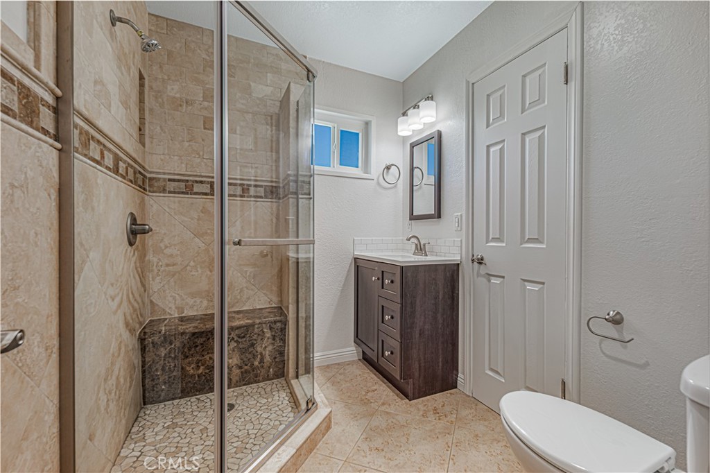 1480 East Colver Place Covina, CA 91724 - Photo 23 of 31 a bathroom with a shower a sink and toilet