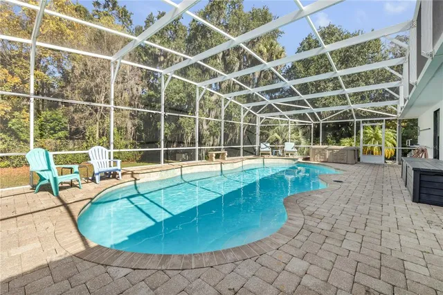 a view of a swimming pool with a patio