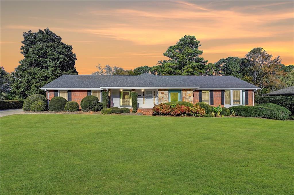 a front of a house with a garden