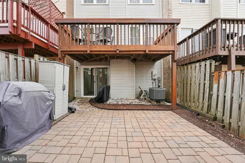 a view of a house with wooden deck