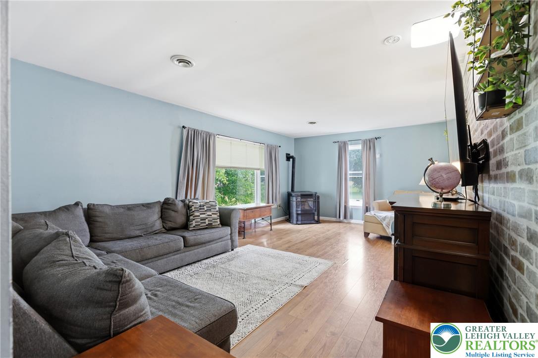 732 Bushkill Center Road Nazareth, PA 18064 - Photo 6 of 43 Hardwood floors and generous windows illuminate this inviting living area.