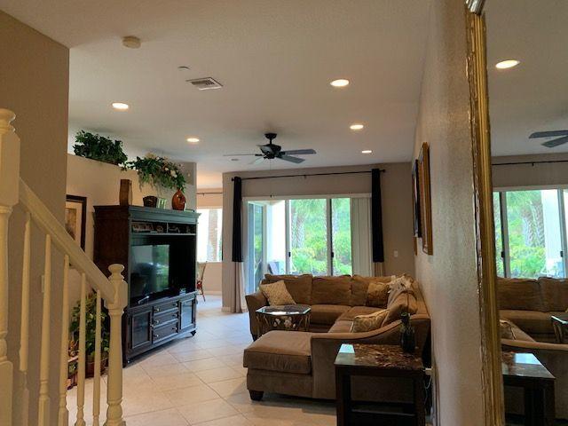 271 Southwest Walking Path Stuart, FL 34997 - Photo 13 of 35 a living room with furniture and a flat screen tv