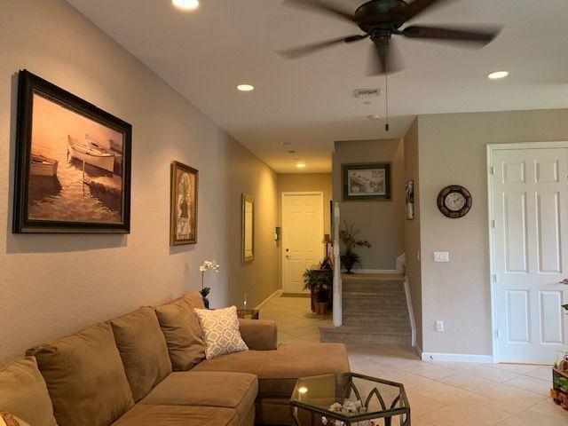 271 Southwest Walking Path Stuart, FL 34997 - Photo 14 of 35 a living room with furniture and a large window