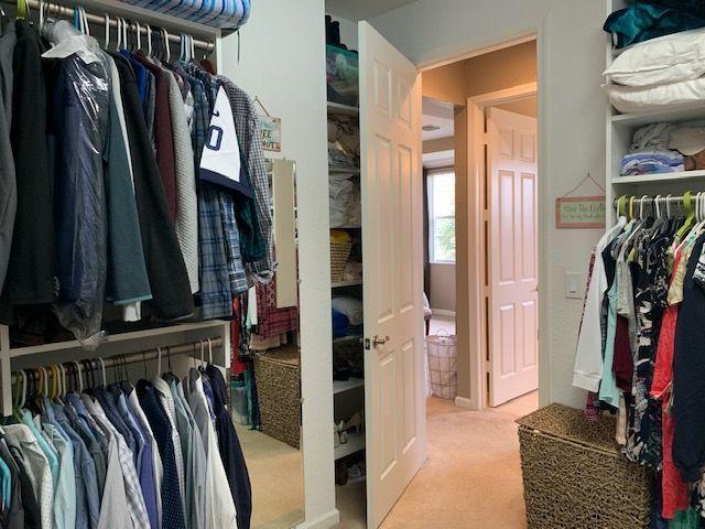 271 Southwest Walking Path Stuart, FL 34997 - Photo 21 of 35 a view of walk in closet with clothes and shoes