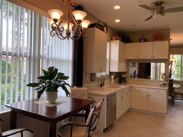 271 Southwest Walking Path Stuart, FL 34997 - Photo 5 of 35 a kitchen with cabinets a sink appliances and a counter top space