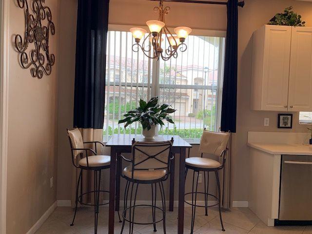 271 Southwest Walking Path Stuart, FL 34997 - Photo 7 of 35 a dining room with furniture and window