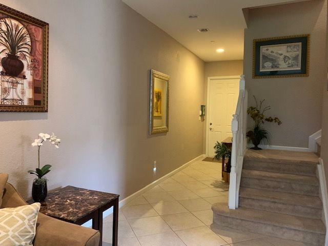 271 Southwest Walking Path Stuart, FL 34997 - Photo 10 of 35 a bedroom with a bed and a table