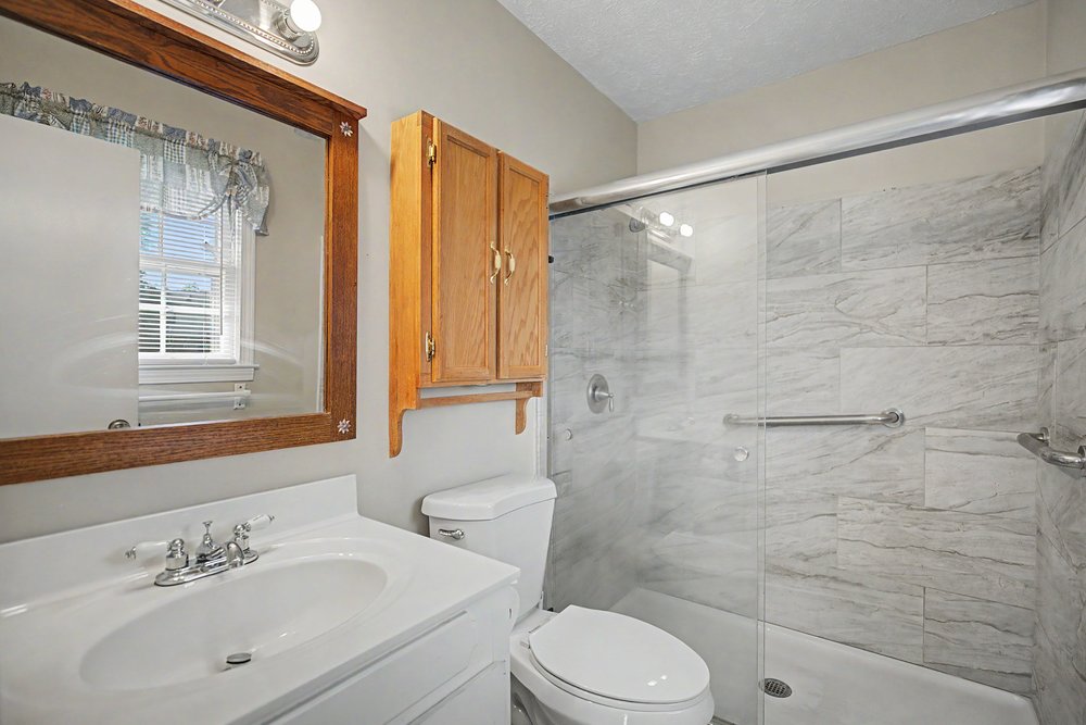 115 Brunson Drive Pickens, SC 29671 - Photo 16 of 29 A well-appointed bathroom with a spacious walk-in shower and elegant tile work.
