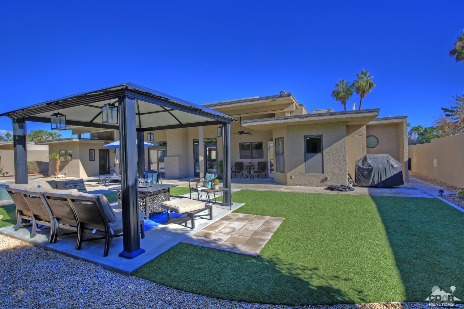 71471 Halgar Road Rancho Mirage, CA 92270 - Photo 1 of 49 a view of a house with backyard porch and sitting area
