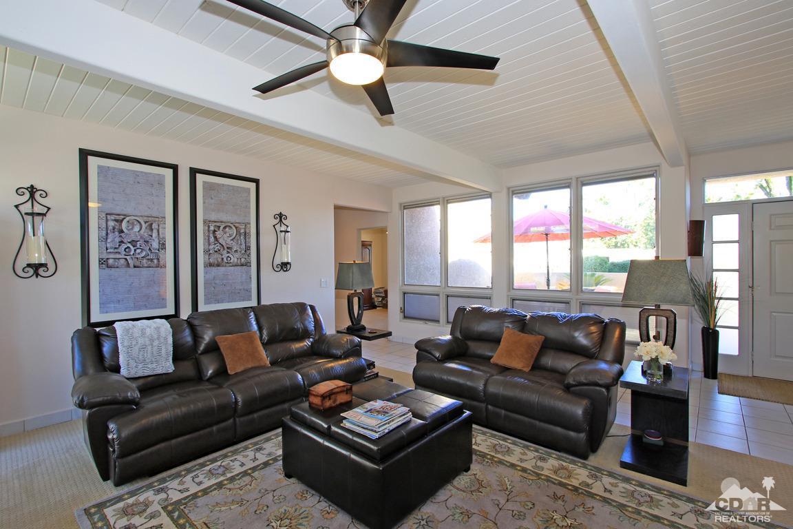 71471 Halgar Road Rancho Mirage, CA 92270 - Photo 13 of 49 a living room with furniture and a large window