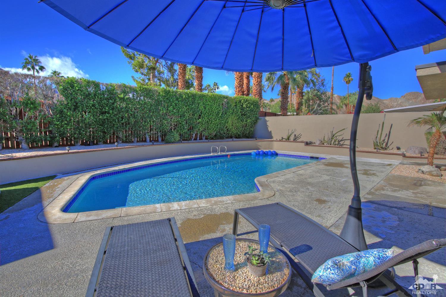 71471 Halgar Road Rancho Mirage, CA 92270 - Photo 3 of 49 a view of a swimming pool with a patio