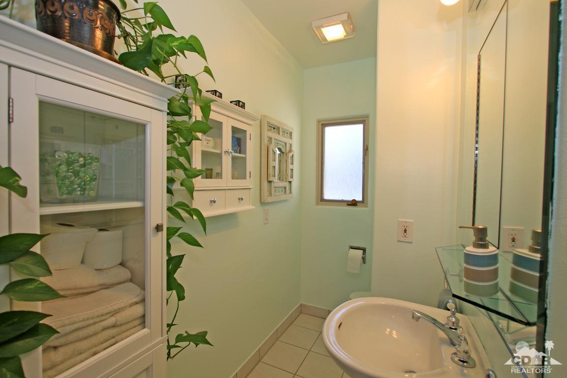 71471 Halgar Road Rancho Mirage, CA 92270 - Photo 32 of 49 a bathroom with a sink and mirror
