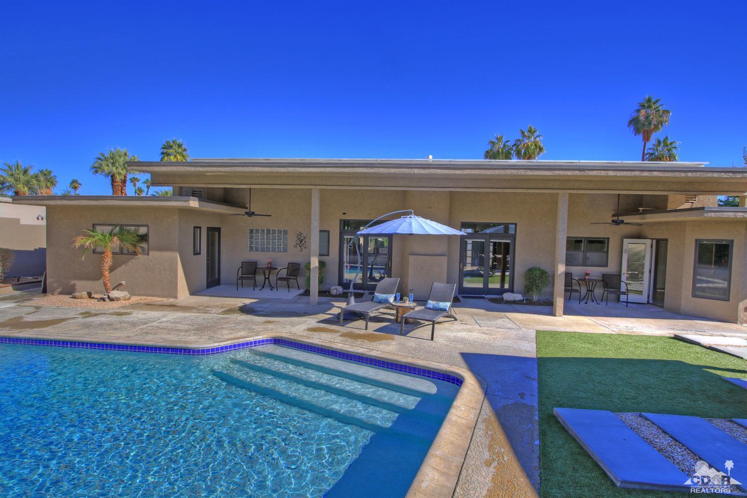 71471 Halgar Road Rancho Mirage, CA 92270 - Photo 44 of 49 a view of a house with backyard sitting area and swimming pool