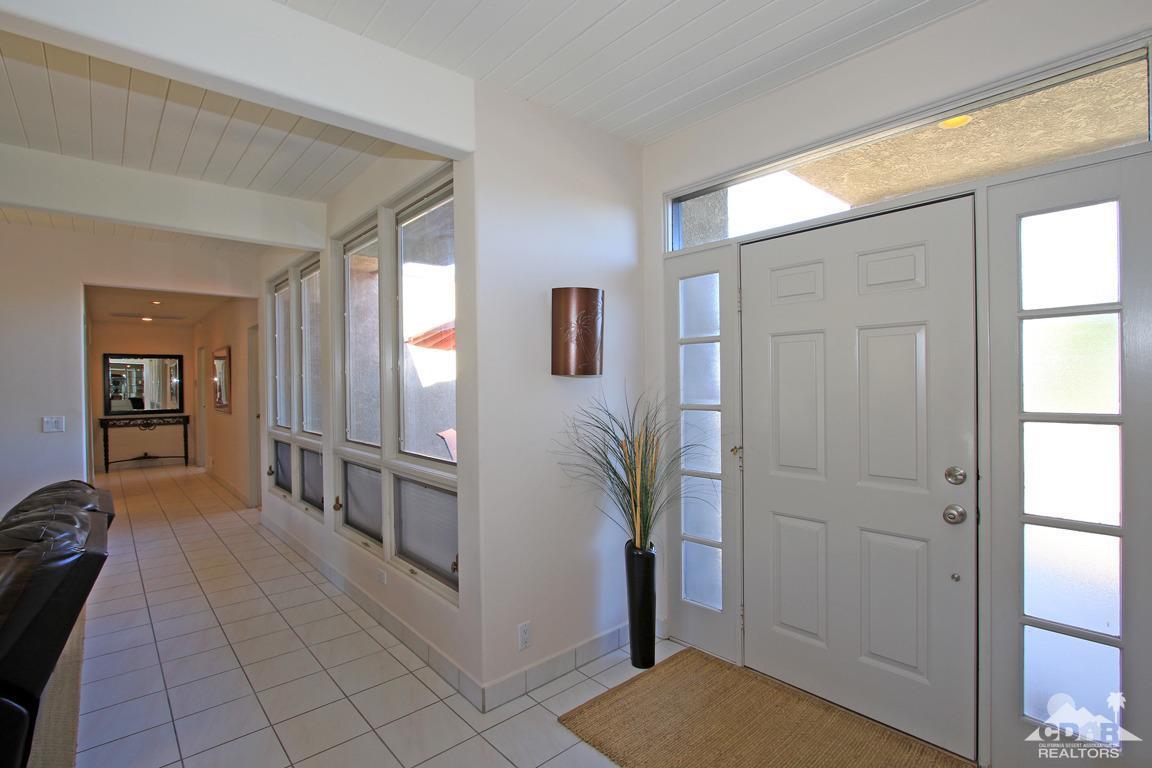 71471 Halgar Road Rancho Mirage, CA 92270 - Photo 5 of 49 a view of a hallway view with wooden floor and living room