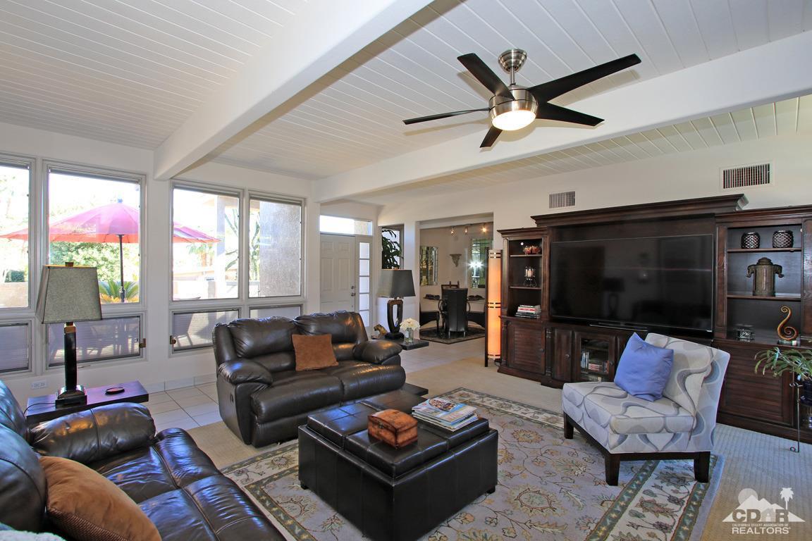 71471 Halgar Road Rancho Mirage, CA 92270 - Photo 6 of 49 a living room with furniture ceiling fan and a window