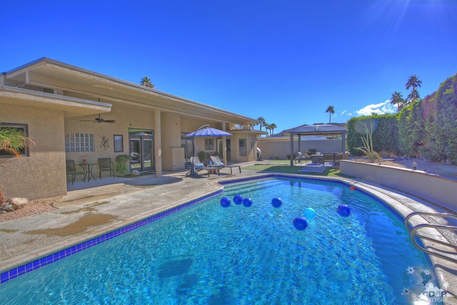 71471 Halgar Road Rancho Mirage, CA 92270 - Photo 8 of 49 a swimming pool with outdoor view