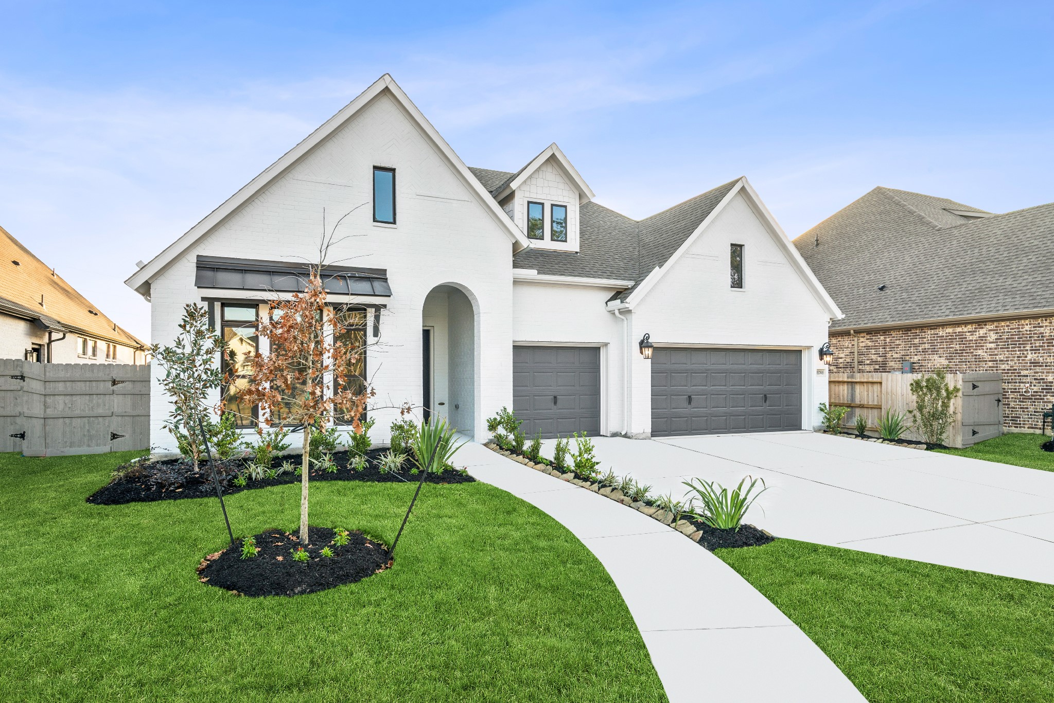 15748 Terracotta Terrace Lane Conroe, TX 77302 - Photo 2 of 50 a front view of a house with a garden and plants