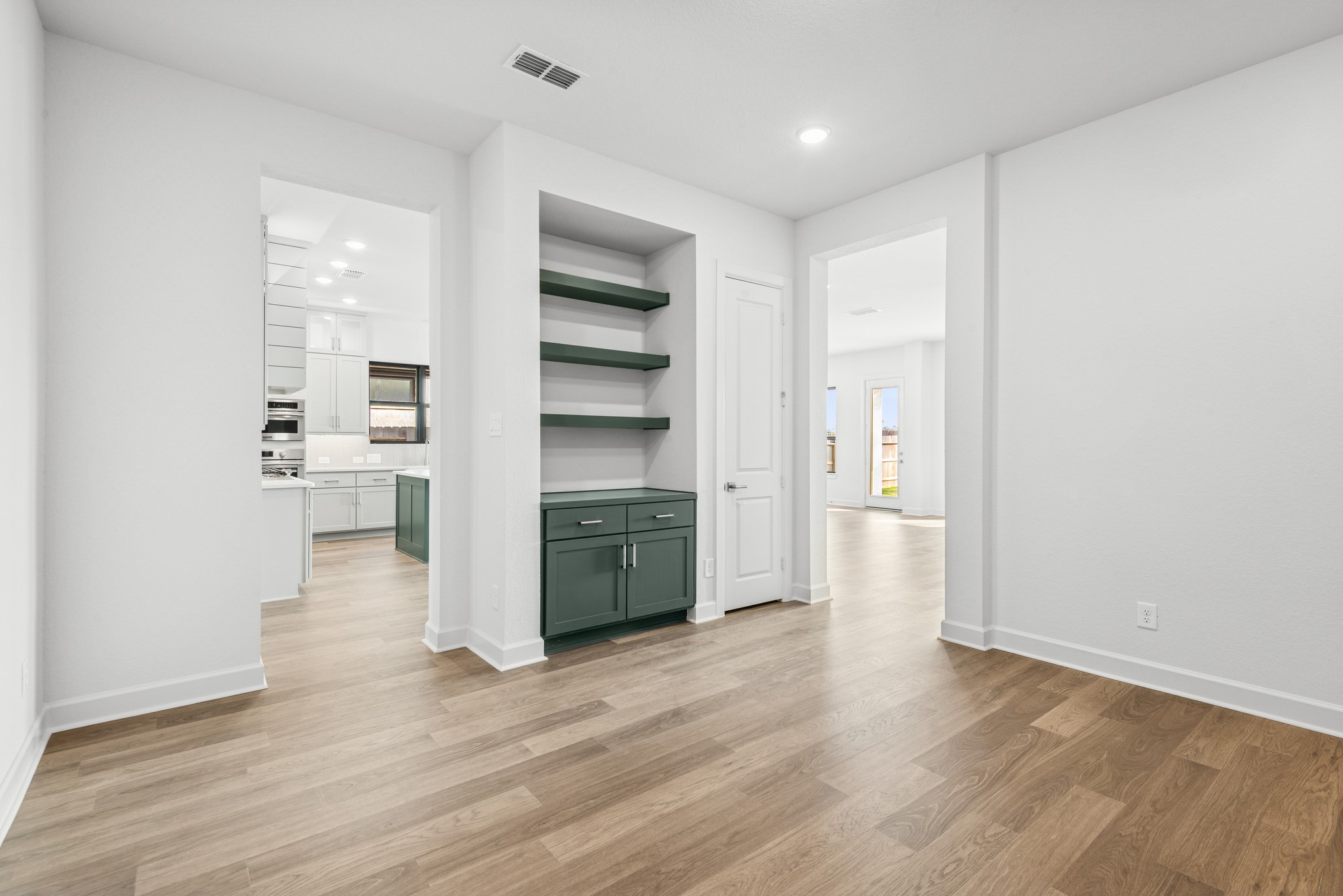 15748 Terracotta Terrace Lane Conroe, TX 77302 - Photo 35 of 50 a view of a kitchen with wooden floor and windows