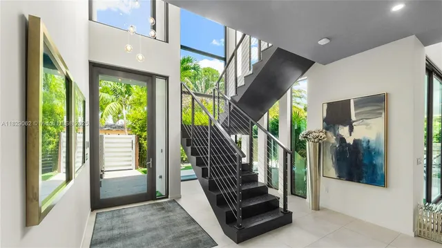 a view of a room with furniture and windows