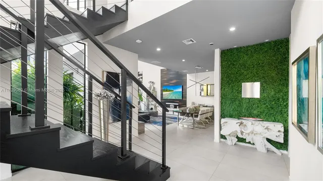 a large kitchen with kitchen island a large window in it