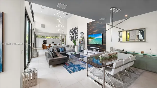 a living room with a large bed couch and a large window