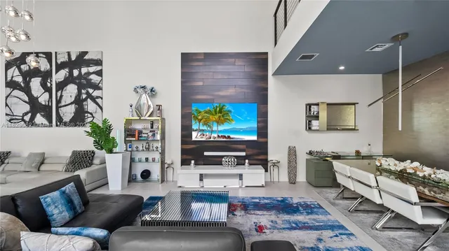 a view of a patio with table and chairs and potted plants