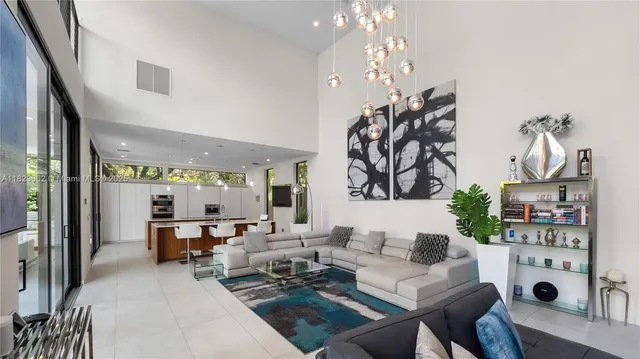 a view of living room with furniture and large window